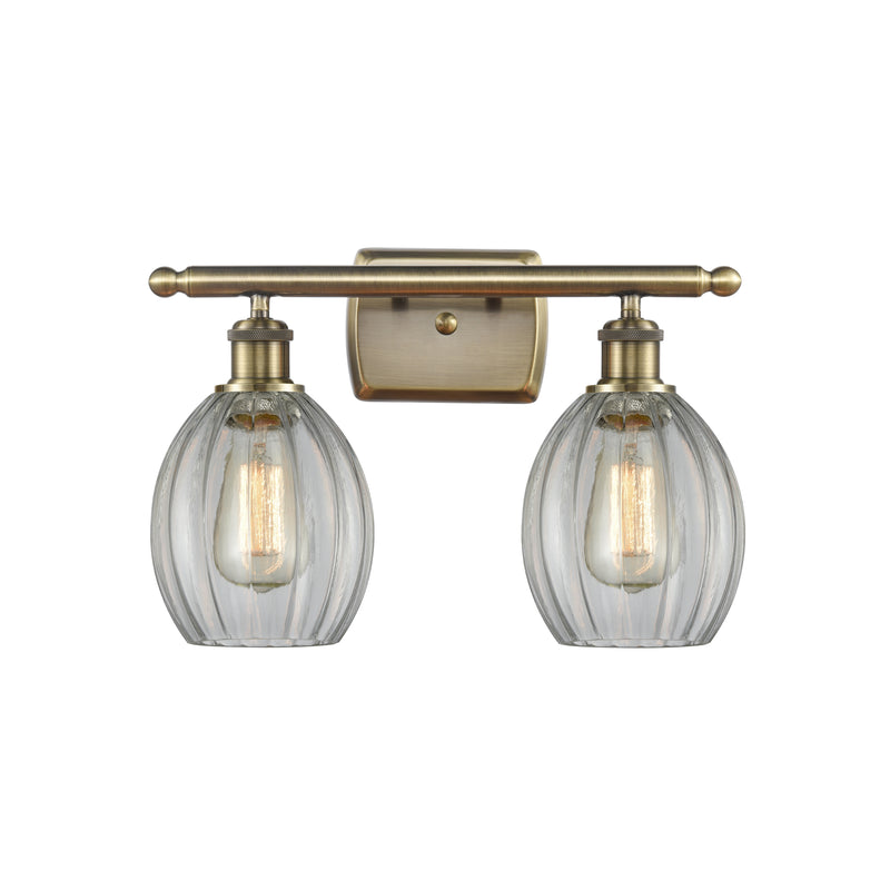 Eaton Bath Vanity Light shown in the Antique Brass finish with a Clear shade