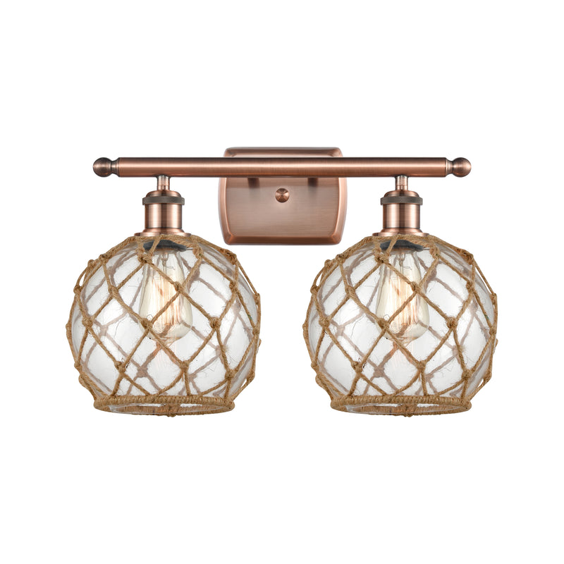 Farmhouse Rope Bath Vanity Light shown in the Antique Copper finish with a Clear Glass with Brown Rope shade