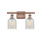Caledonia Bath Vanity Light shown in the Antique Copper finish with a Mouchette shade