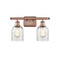 Caledonia Bath Vanity Light shown in the Antique Copper finish with a Mica shade