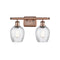 Salina Bath Vanity Light shown in the Antique Copper finish with a Clear Spiral Fluted shade