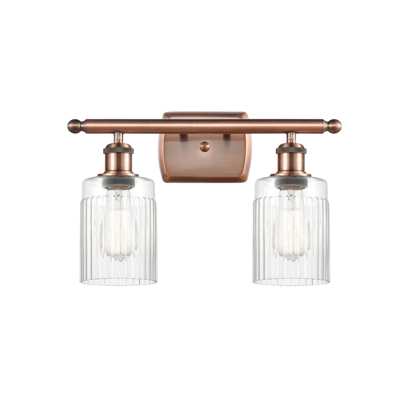 Hadley Bath Vanity Light shown in the Antique Copper finish with a Clear shade
