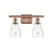 Ellery Bath Vanity Light shown in the Antique Copper finish with a Seedy shade
