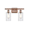 Clymer Bath Vanity Light shown in the Antique Copper finish with a Clear shade