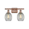 Eaton Bath Vanity Light shown in the Antique Copper finish with a Clear shade