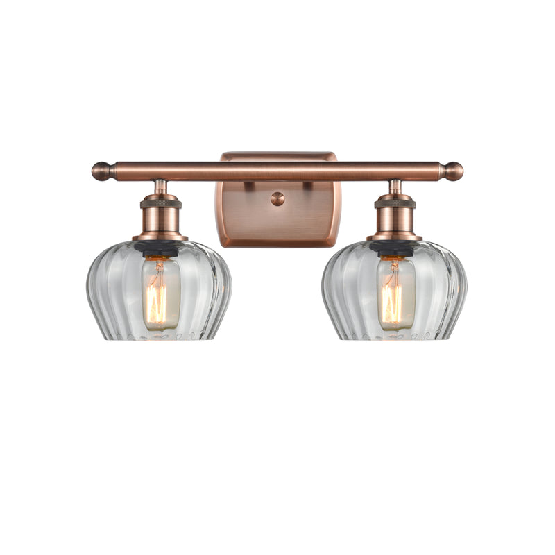 Fenton Bath Vanity Light shown in the Antique Copper finish with a Clear shade