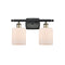 Cobbleskill Bath Vanity Light shown in the Black Antique Brass finish with a Matte White shade