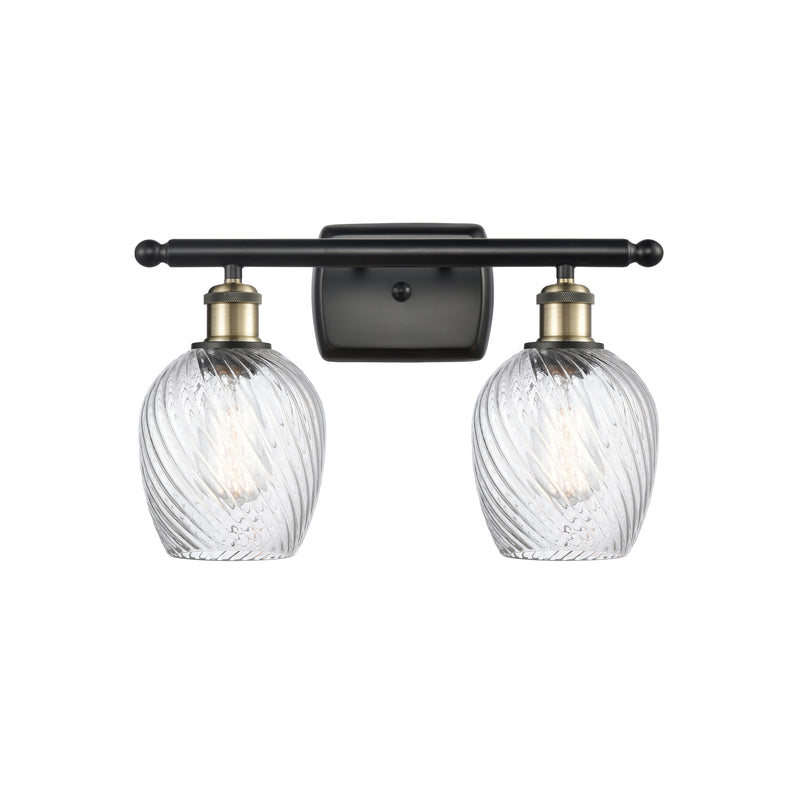 Salina Bath Vanity Light shown in the Black Antique Brass finish with a Clear Spiral Fluted shade