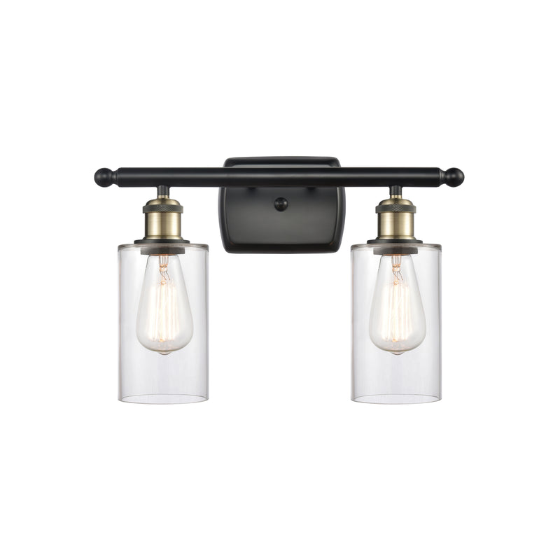 Clymer Bath Vanity Light shown in the Black Antique Brass finish with a Clear shade