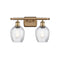 Salina Bath Vanity Light shown in the Brushed Brass finish with a Clear Spiral Fluted shade