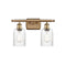 Hadley Bath Vanity Light shown in the Brushed Brass finish with a Clear shade