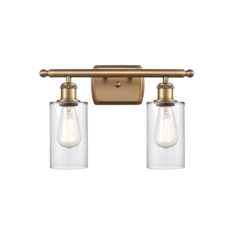 Clymer Bath Vanity Light shown in the Brushed Brass finish with a Clear shade
