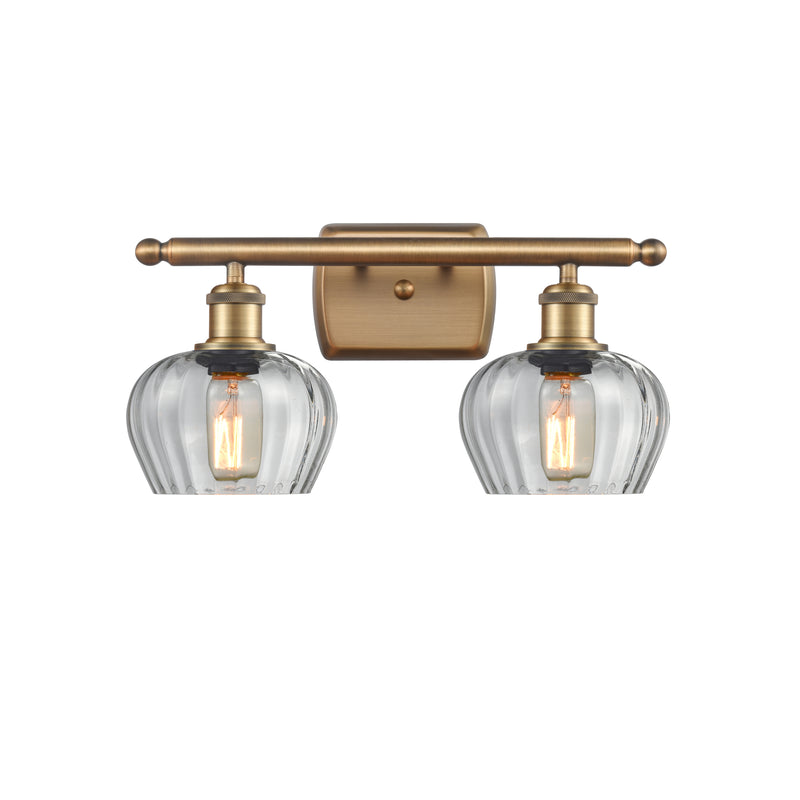 Fenton Bath Vanity Light shown in the Brushed Brass finish with a Clear shade