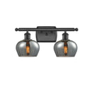 Fenton Bath Vanity Light shown in the Matte Black finish with a Plated Smoke shade