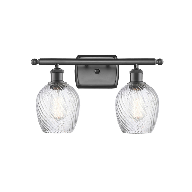 Salina Bath Vanity Light shown in the Oil Rubbed Bronze finish with a Clear Spiral Fluted shade