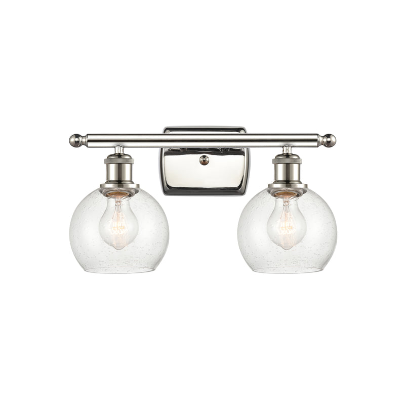 Athens Bath Vanity Light shown in the Polished Nickel finish with a Seedy shade