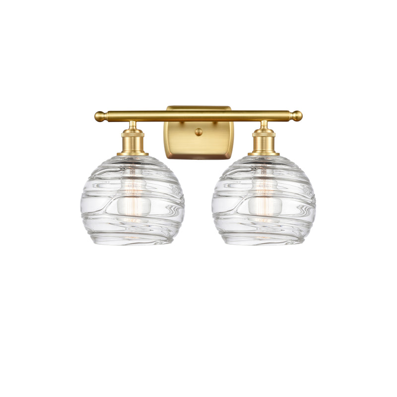 Deco Swirl Bath Vanity Light shown in the Satin Gold finish with a Clear shade