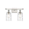 Candor Bath Vanity Light shown in the White and Polished Chrome finish with a Clear Waterglass shade
