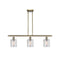 Cobbleskill Island Light shown in the Antique Brass finish with a Clear shade