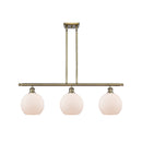 Athens Island Light shown in the Antique Brass finish with a Matte White shade