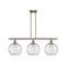 Deco Swirl Island Light shown in the Antique Brass finish with a Clear shade