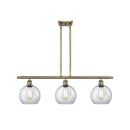 Athens Island Light shown in the Antique Brass finish with a Clear shade