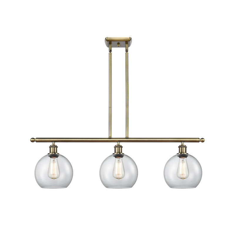 Athens Island Light shown in the Antique Brass finish with a Clear shade