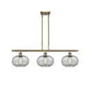 Gorham Island Light shown in the Antique Brass finish with a Charcoal shade