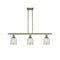 Caledonia Island Light shown in the Antique Brass finish with a Mica shade