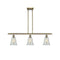 Hanover Island Light shown in the Antique Brass finish with a Mouchette shade