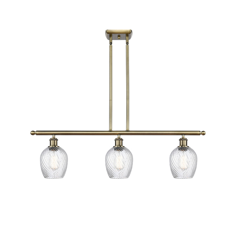 Salina Island Light shown in the Antique Brass finish with a Clear Spiral Fluted shade