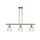 Castile Island Light shown in the Antique Brass finish with a Clear shade