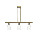 Ellery Island Light shown in the Antique Brass finish with a Seedy shade