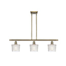 Niagra Island Light shown in the Antique Brass finish with a Clear shade