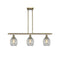 Eaton Island Light shown in the Antique Brass finish with a Clear shade