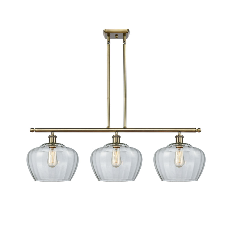 Fenton Island Light shown in the Antique Brass finish with a Clear shade