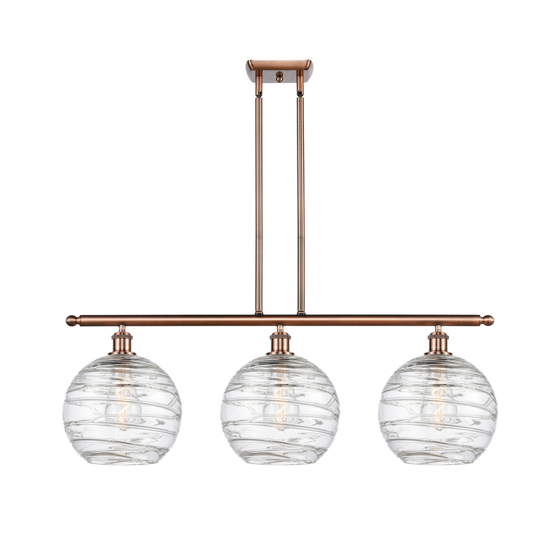 Deco Swirl Island Light shown in the Antique Copper finish with a Clear shade