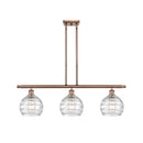 Deco Swirl Island Light shown in the Antique Copper finish with a Clear shade