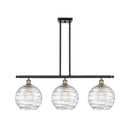 Deco Swirl Island Light shown in the Black Antique Brass finish with a Clear shade