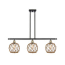 Farmhouse Rope Island Light shown in the Black Antique Brass finish with a Clear Glass with Brown Rope shade