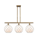 Farmhouse Rope Island Light shown in the Brushed Brass finish with a White Glass with White Rope shade