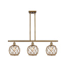 Farmhouse Rope Island Light shown in the Brushed Brass finish with a Clear Glass with Brown Rope shade