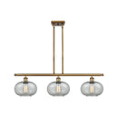 Gorham Island Light shown in the Brushed Brass finish with a Charcoal shade