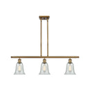 Hanover Island Light shown in the Brushed Brass finish with a Fishnet shade