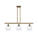 Waverly Island Light shown in the Brushed Brass finish with a Clear shade