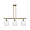 Waverly Island Light shown in the Brushed Brass finish with a Clear shade