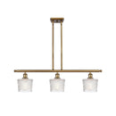 Niagra Island Light shown in the Brushed Brass finish with a Clear shade