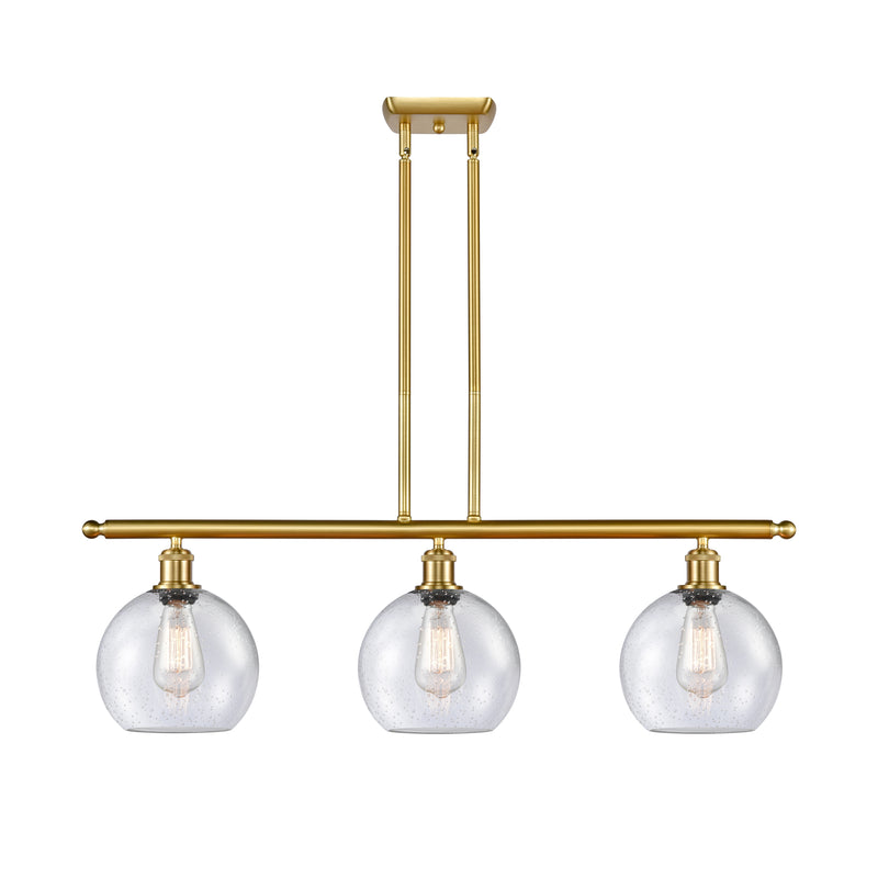 Athens Island Light shown in the Satin Gold finish with a Seedy shade