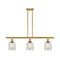 Caledonia Island Light shown in the Satin Gold finish with a Mica shade