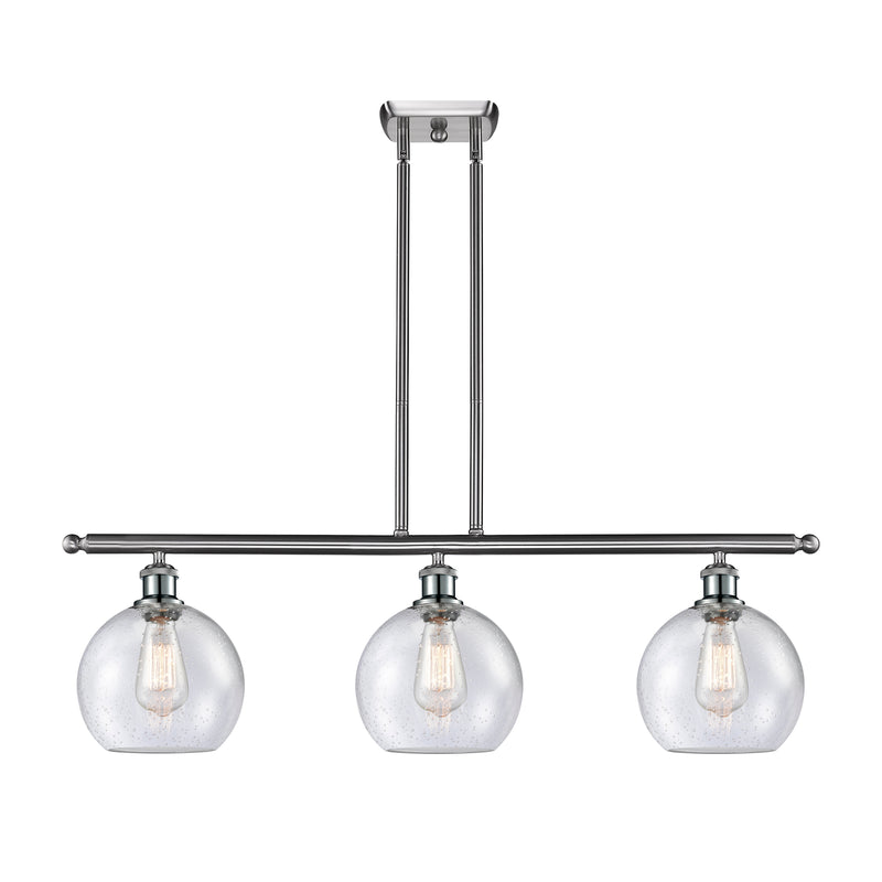 Athens Island Light shown in the Brushed Satin Nickel finish with a Seedy shade